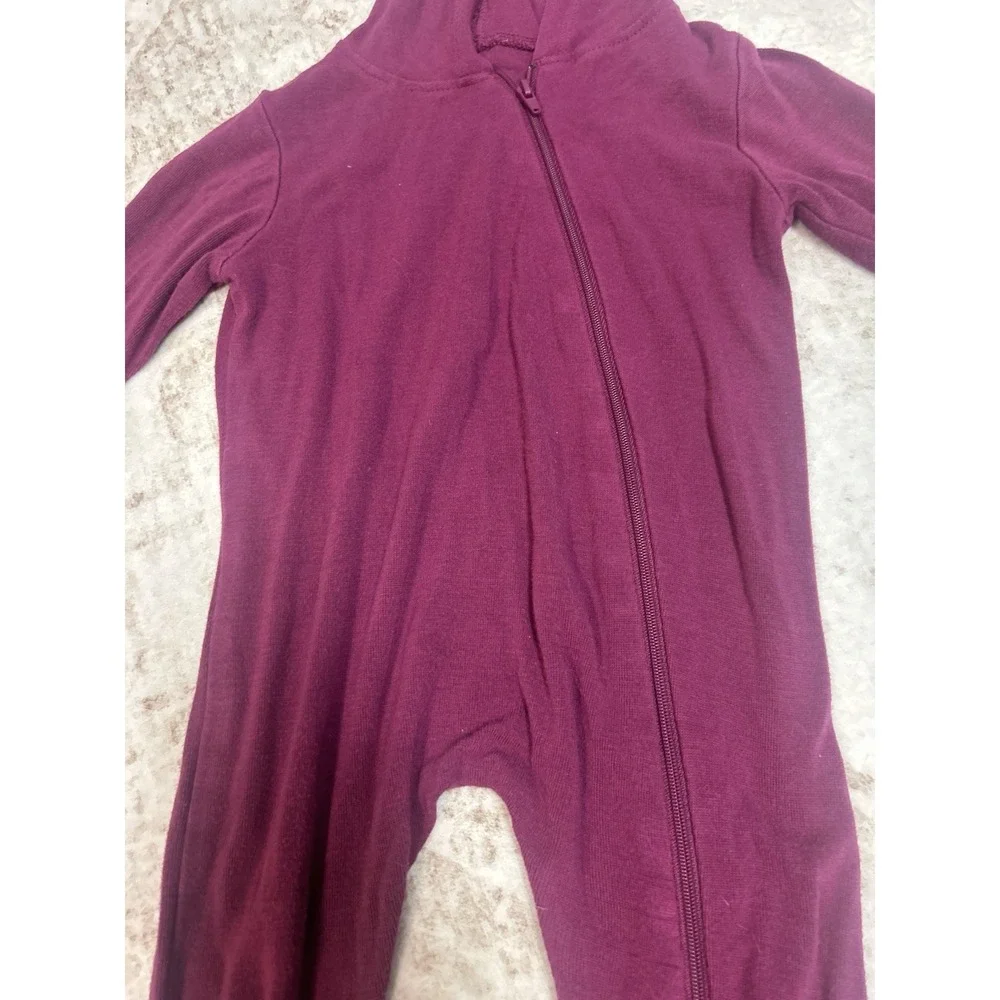 Kyte Baby Bamboo Jersey Hooded Zippered Romper in the color Dahlia